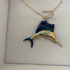 14k solid gold custom made Marlin pendant.